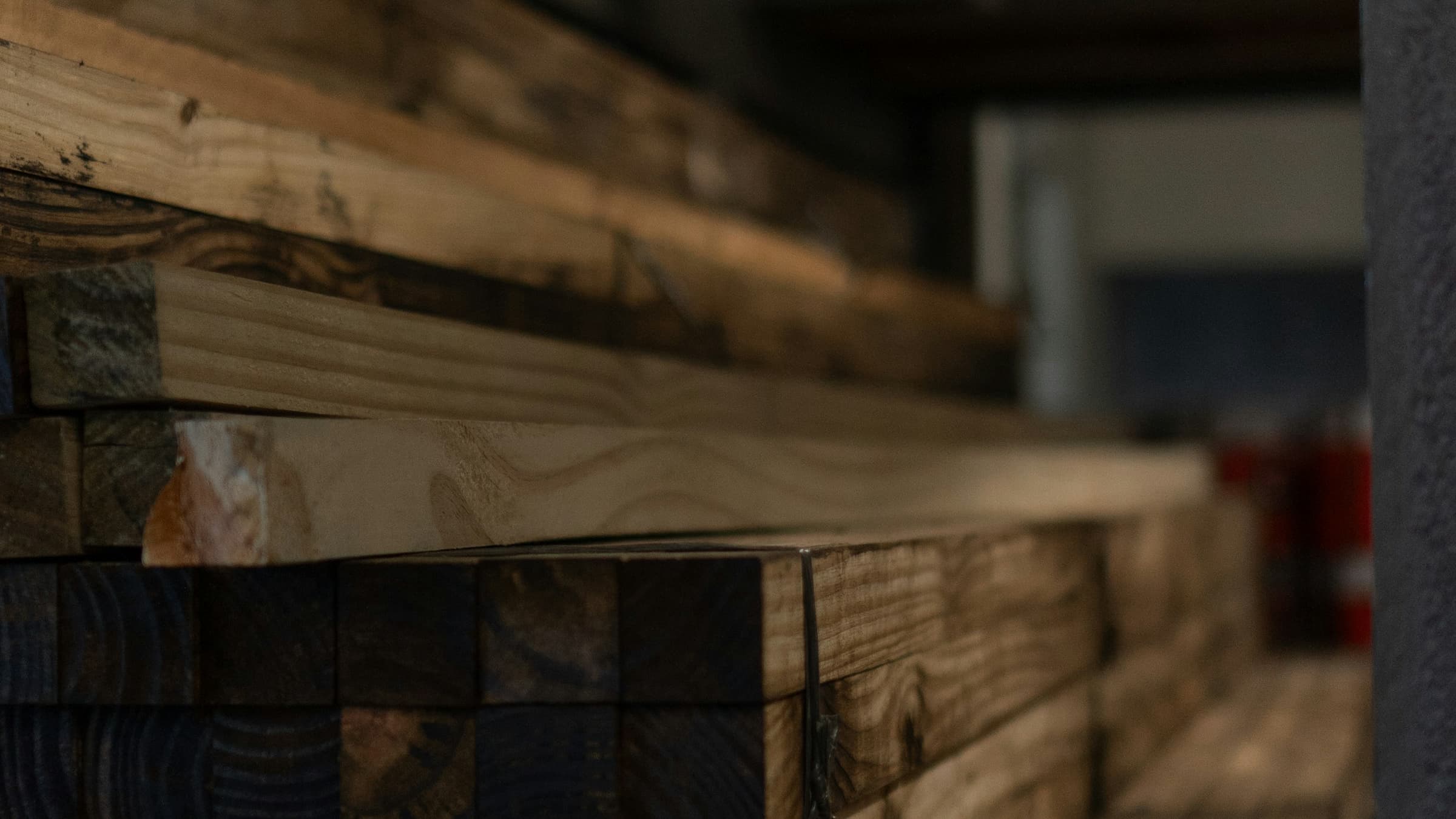 Stacked timber and planks in a materials warehouse
