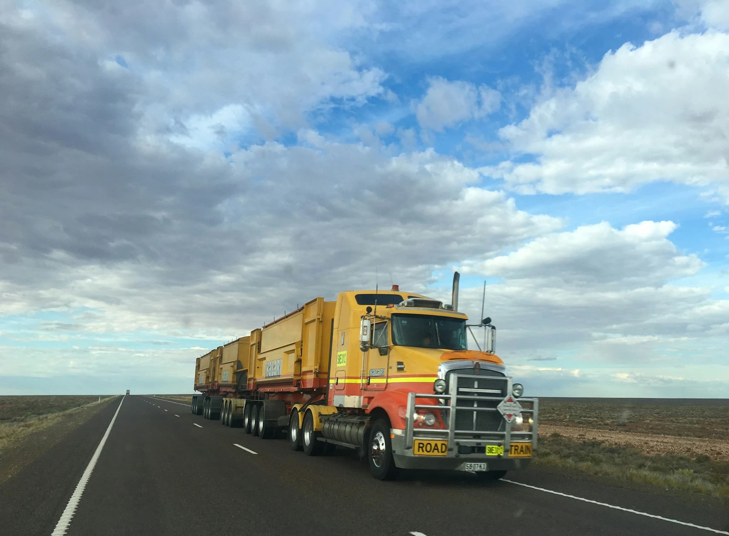 Commercial vehicles on a highway representing fleet and transport