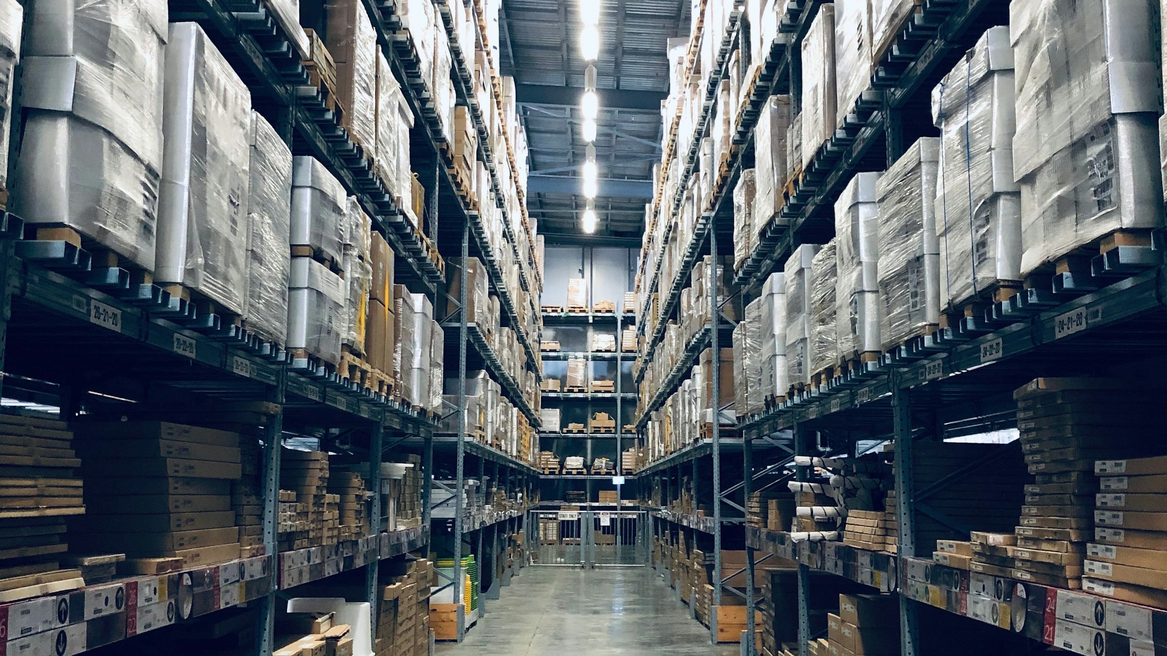 Industrial warehouse with forklifts moving inventory