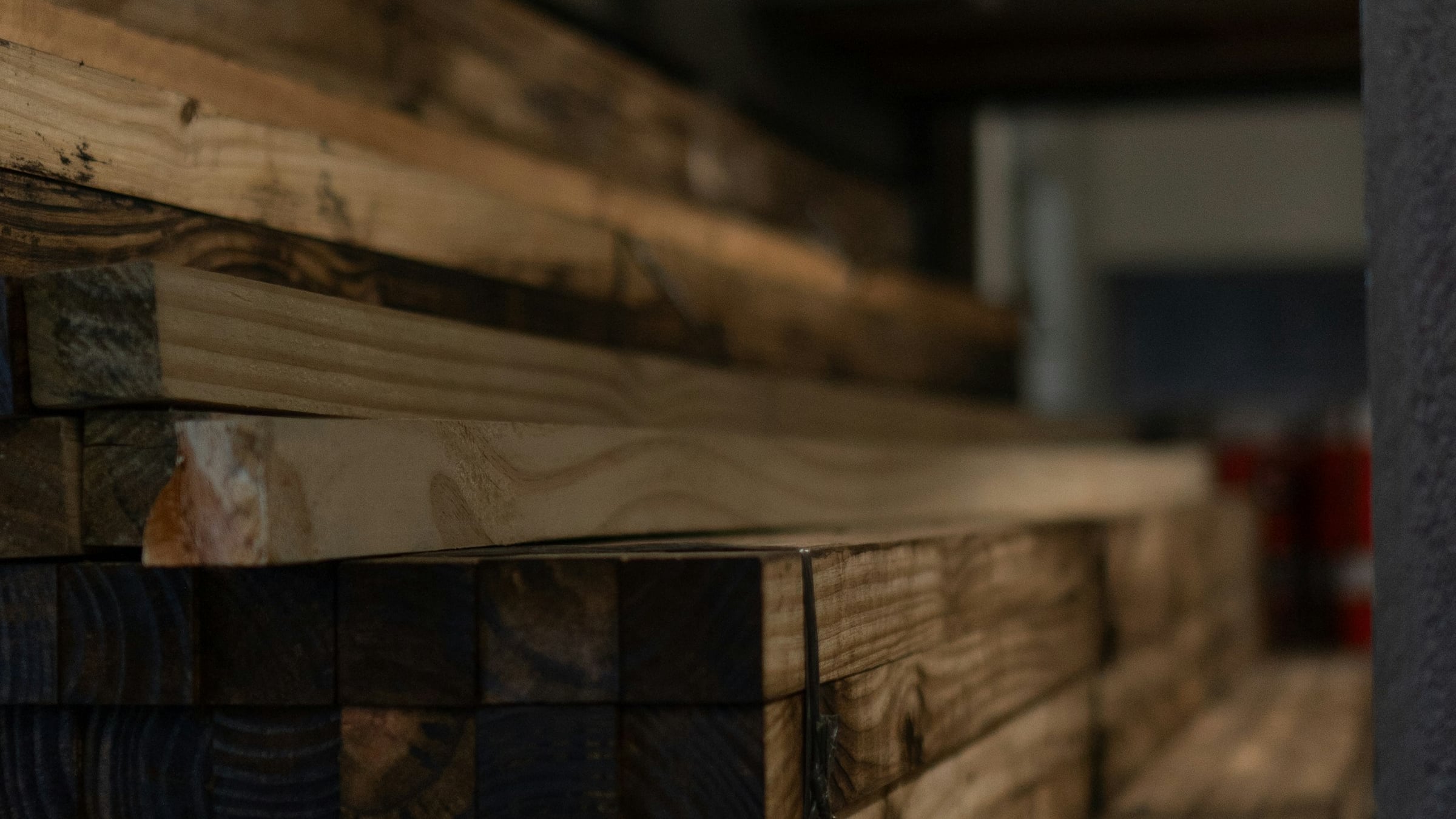 Stacked timber and planks in a materials warehouse